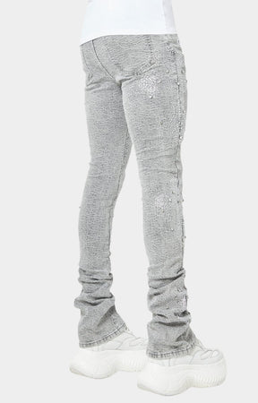 Luxury streetwear denim with crystal-encrusted cross patterns.