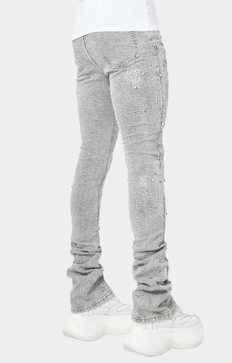 Luxury streetwear denim with crystal-encrusted cross patterns.