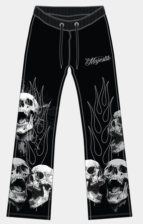 Majestik men’s black tapestry pants front view with skull branding and rhinestone detail. 