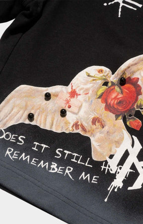 Close-up of AMORE graphic on Makobi Black Shorts.