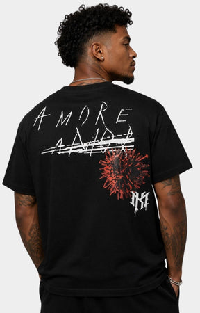 Makobi black shirt featuring oversized AMORE wing and rose graphic.