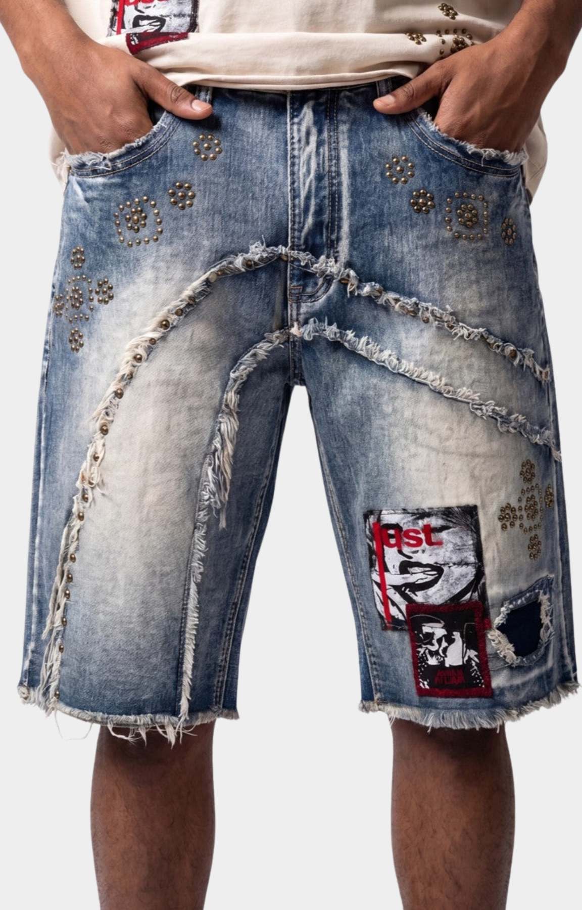 Distressed panel detail on Makobi Dolore Pain Denim Shorts.