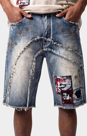 Distressed panel detail on Makobi Dolore Pain Denim Shorts.