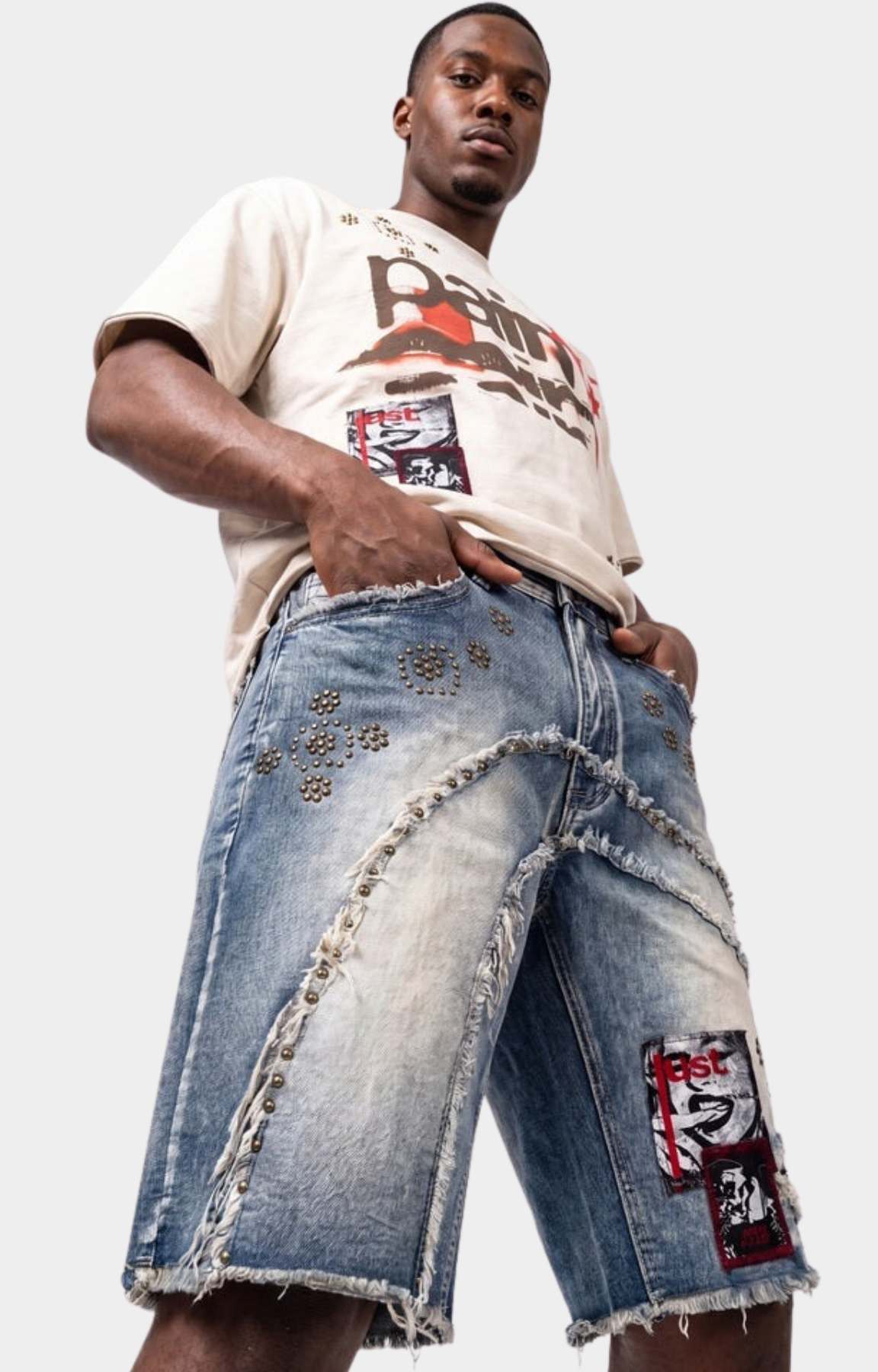 Stud embellishment detail on Makobi Dolore Pain Denim Shorts.