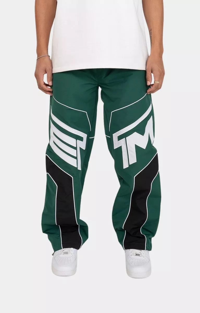 Men wearing hunter green streetwear track pants by EPTM