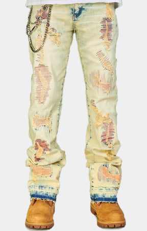 DISTRESSED STACKED JEANS WITH CHAIN ACCENT
