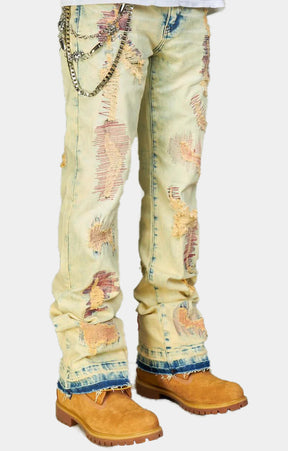 DISTRESSED STACKED JEANS WITH CHAIN ACCENT