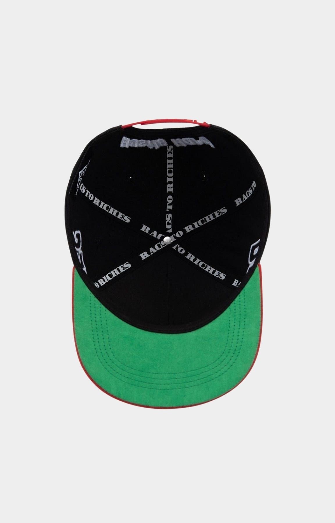 Adjustable red snapback closure on Paper Money hat.