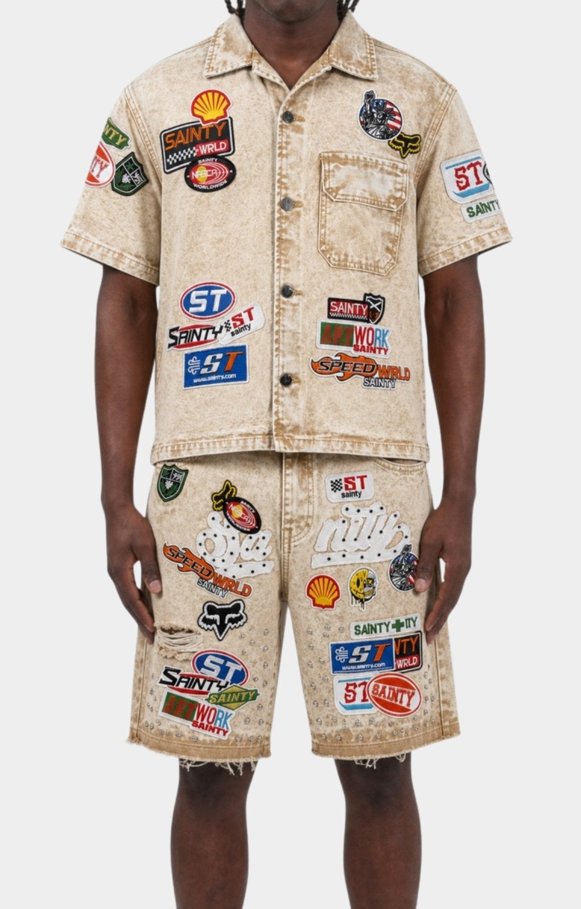 Close-up of rhinestone embellishments on Politics khaki denim shorts.