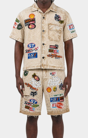 Close-up of rhinestone embellishments on Politics khaki denim shorts.