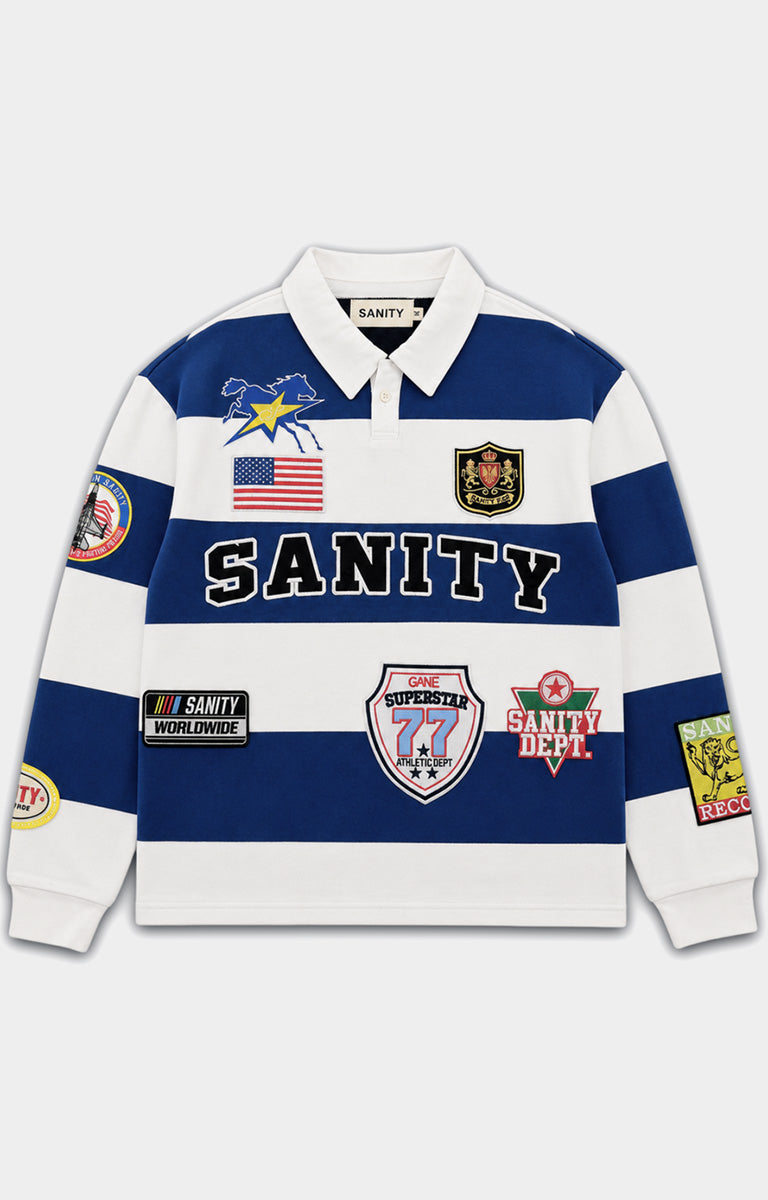 Politics Shirt Casa in blue featuring a 100% cotton construction, blue and white striped design, long sleeves, classic polo collar, SANITY lettering, and detailed embroidered patches.