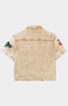 Premium streetwear denim shirt with embroidered patchwork design.