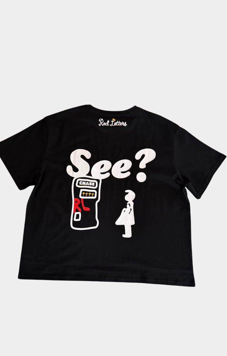 Close-up of I'll Be At The Bank graphic on Red Letters tee.