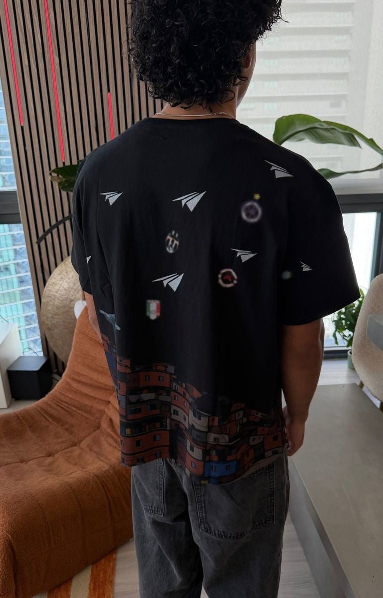 Red Letters Favelas tee with paper airplane gr.aphic details