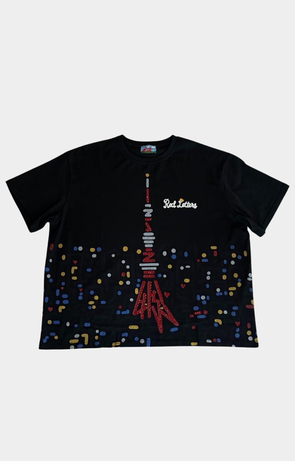 Red Letters black tee featuring colorful cityscape inspired lower graphic.