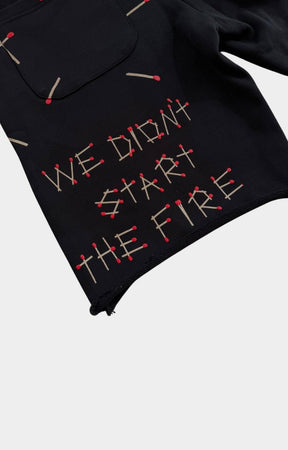Hand-frayed distressed hem on Red Letters black French Terry shorts.