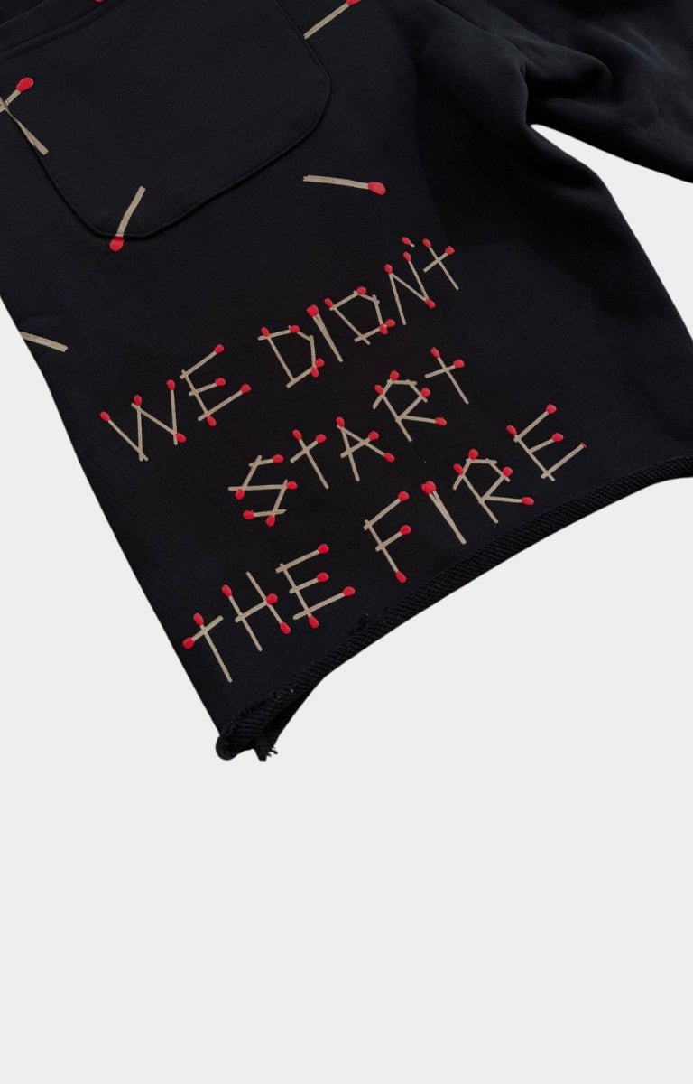 Hand-frayed distressed hem on Red Letters black French Terry shorts.