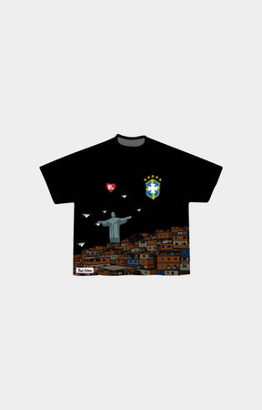 Red Letters Favelas black short-sleeve t-shirt featuring a graphic print of Rio de Janeiro, including the Christ the Redeemer statue, favela houses, a red heart, and Brazil national team crests. 