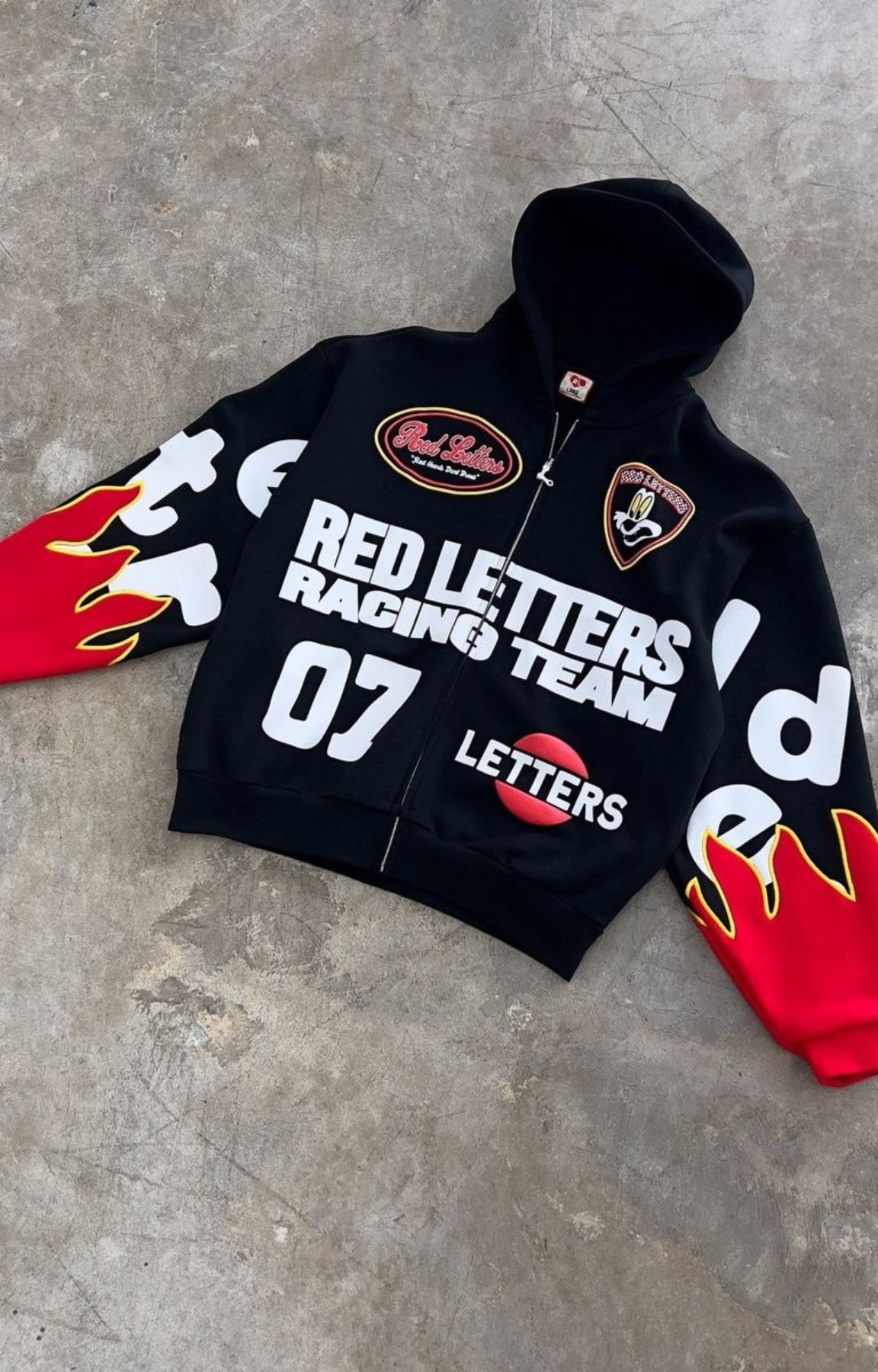 Red Letters Nashcar Scattered Zip Up Hoodie oversized sleeve detail. 