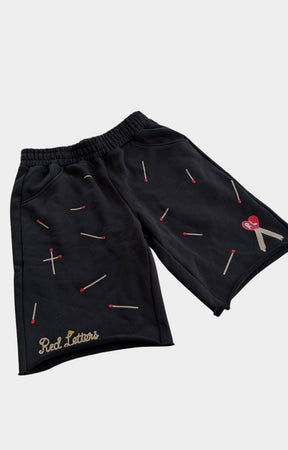 Relaxed fit Red Letters Start The Fire graphic shorts.
