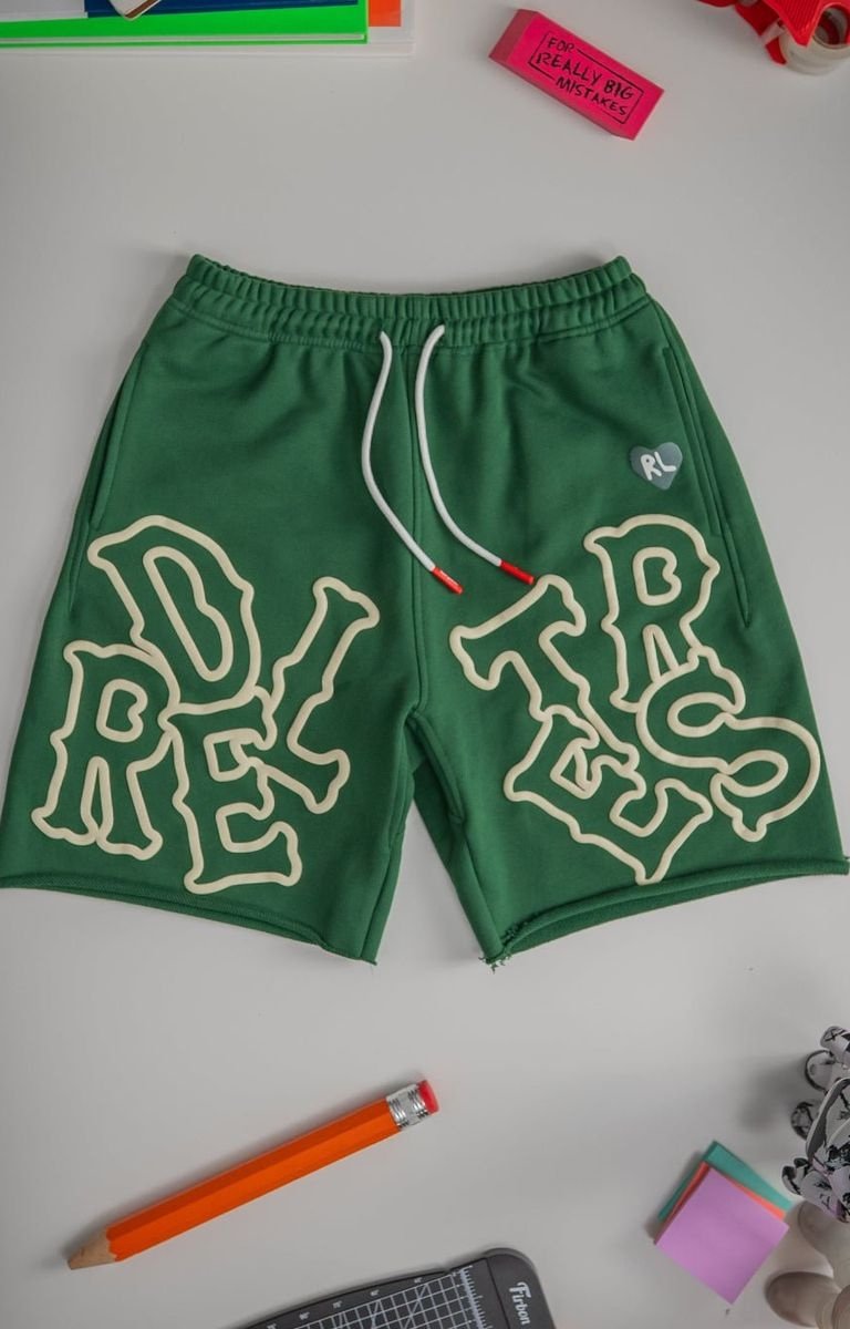 Red Letters Scattered Sweat Shorts in Green – Oversized RL Lettering – Front View