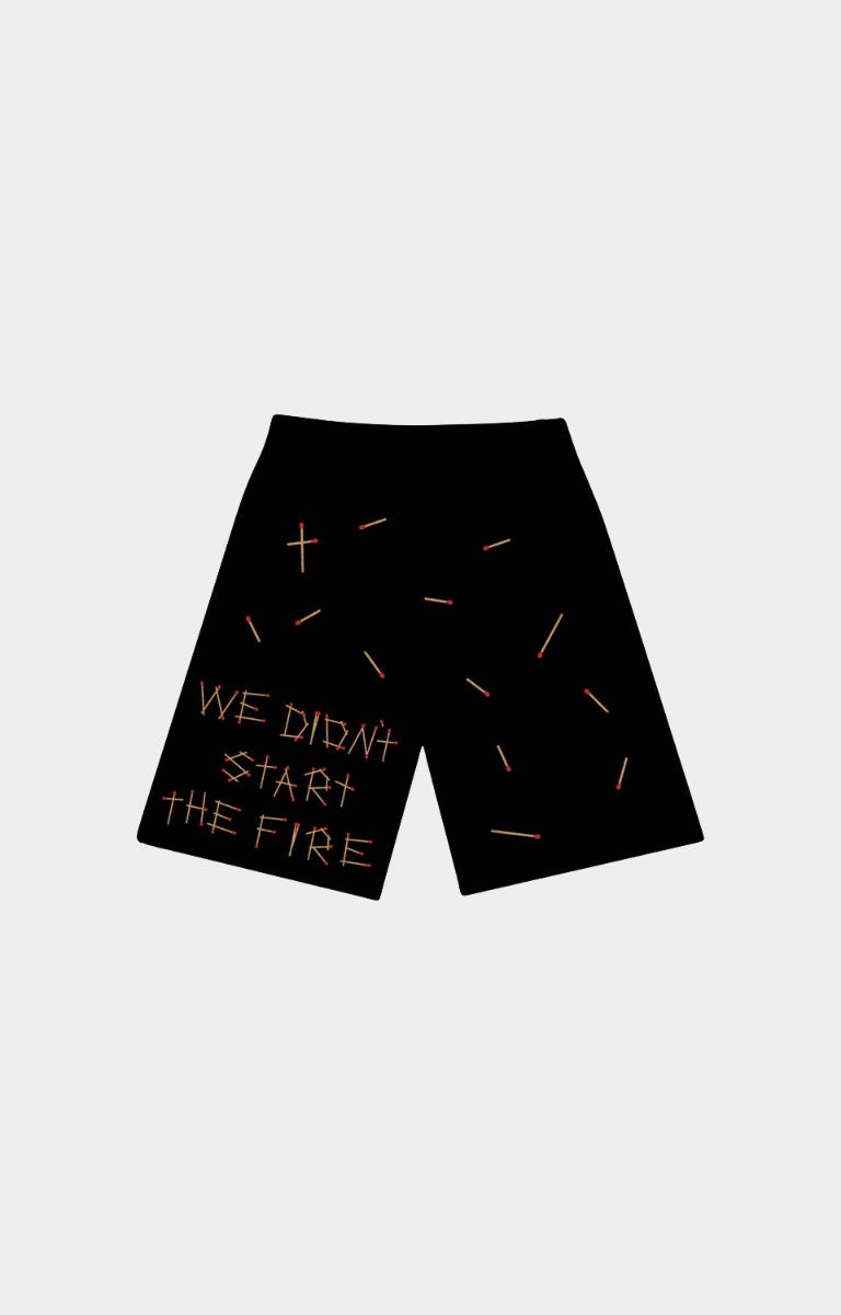 Red Letters start the fire french terry Black shorts with a graphic design featuring the text 'WE DIDN'T START THE FIRE' in white, accompanied by matchsticks design all over at back side. 