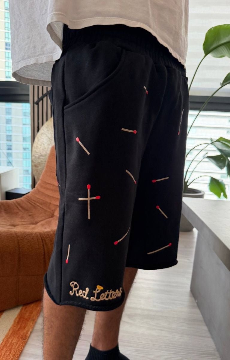 Angled view of Red Letters Start The Fire shorts.