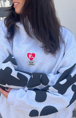 Close-up of Baby Fred space illustration on Therapy Scattered Hoodie