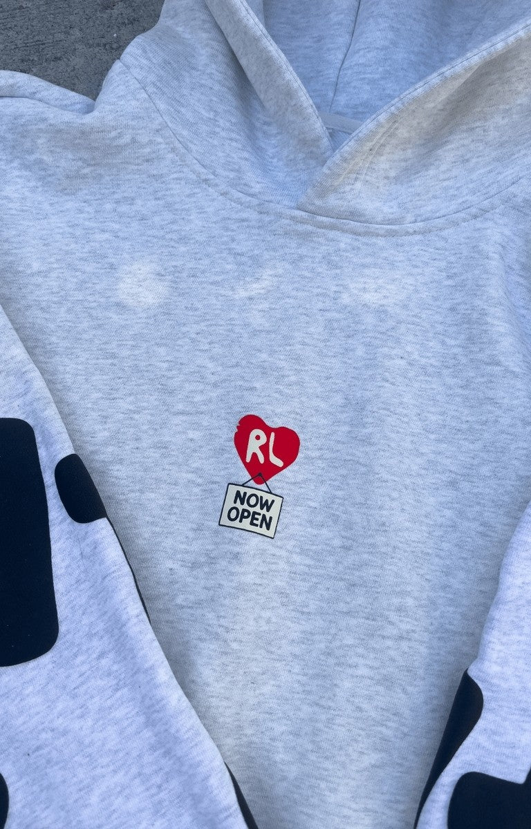 Flat lay of Red Letters Therapy Scattered Hoodie showing front and back design