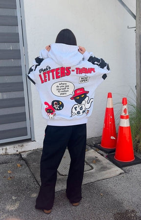 Back View of Model wearing oversized Red Letters Therapy Scattered Hoodie in streetwear fit.