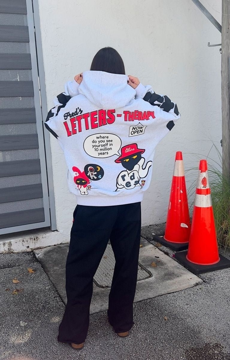 Back View of Model wearing oversized Red Letters Therapy Scattered Hoodie in streetwear fit.