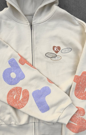 Lifestyle photo of Red Letters Where U Are Scattered Zip Up styled in streetwear outfit