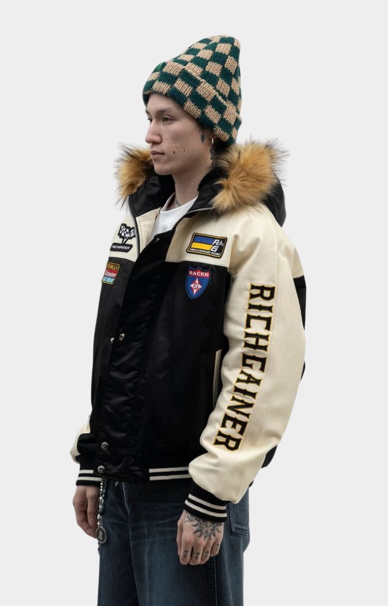 Side profile of Rich Gainer faux fur hoodie varsity jacket