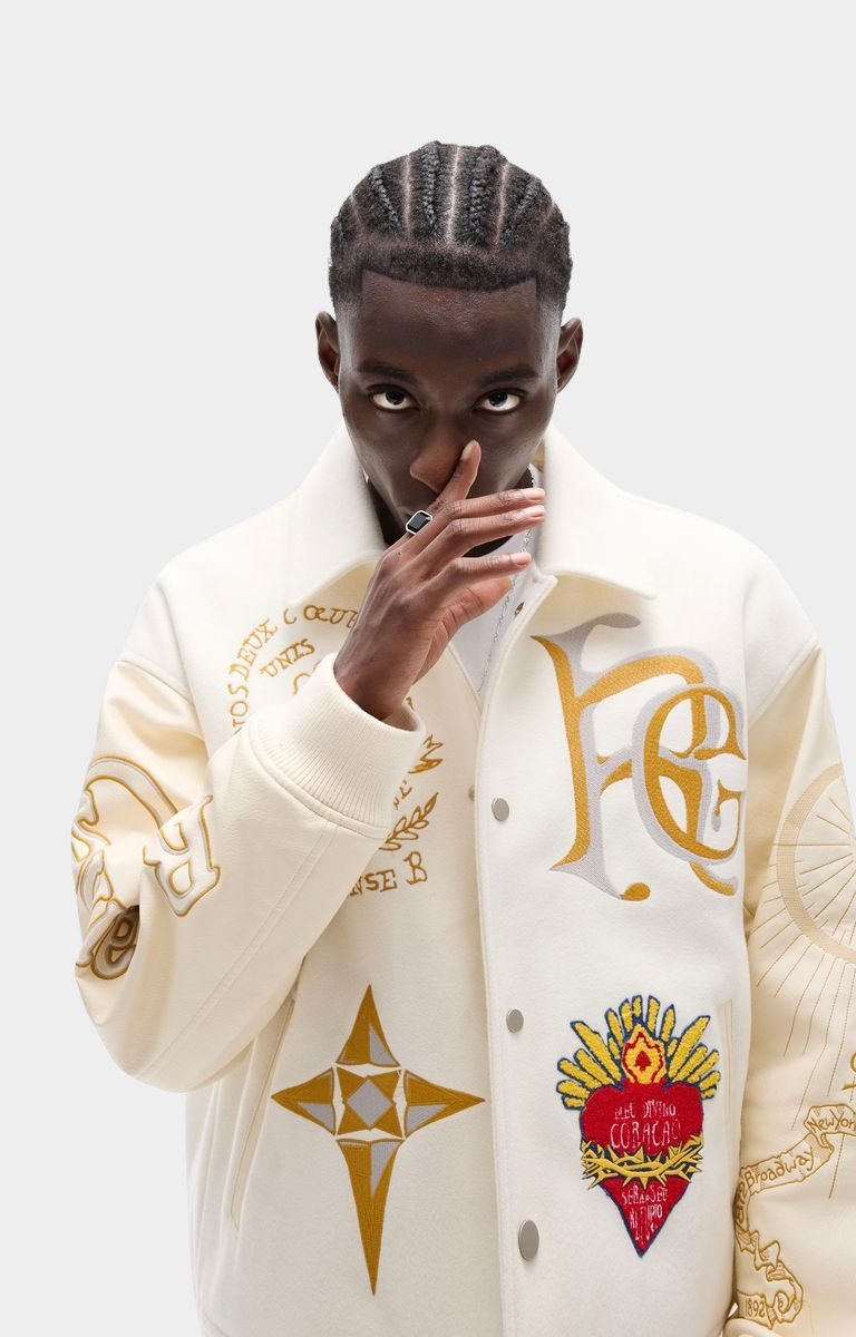 Rich Gainer monogram logo embroidery on white jacket.