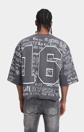 Back view of Syndicate 16 cropped graphic T-shirt.