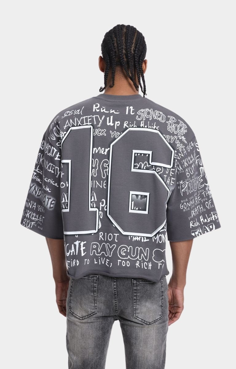 Back view of Syndicate 16 cropped graphic T-shirt.