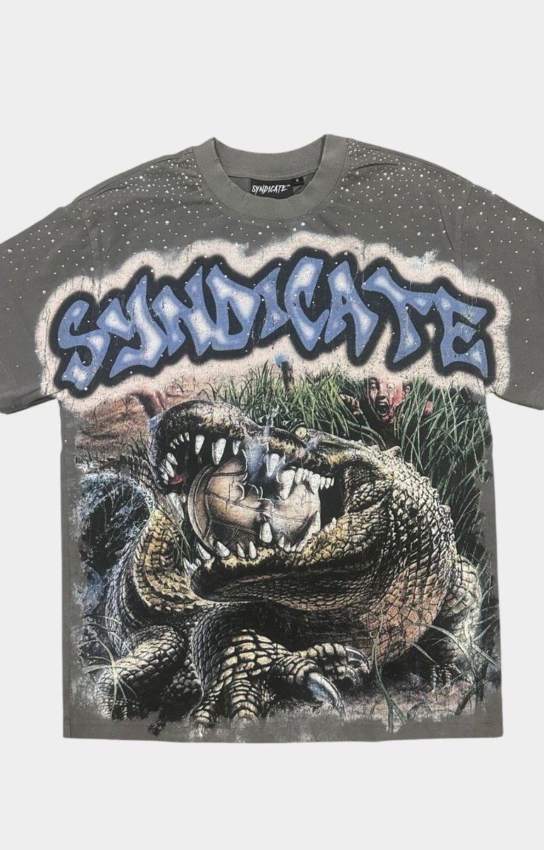 Close-up of crocodile graphic and icy blue Syndicate graffiti logo with rhinestones.