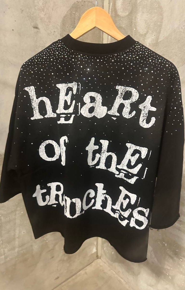 Back view featuring large Heart of the Trenches text print.