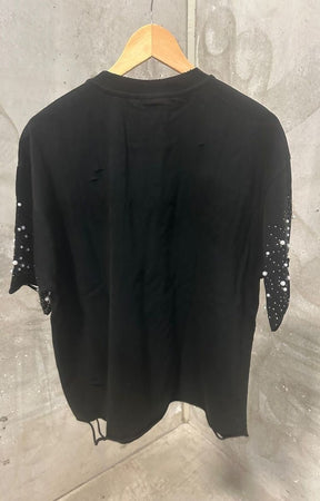 Back view of distressed ivory cropped embellished sleeves streetwear tee.