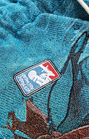 Embroidery close-up on VeryRare Thorns/War Pants Raf Reyes design.