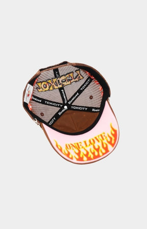 Curved brim detail of brown streetwear cap.