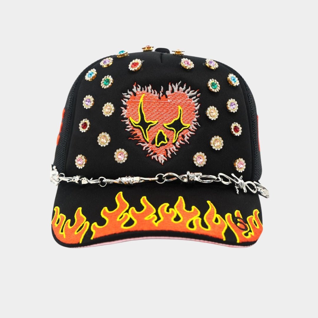 Front view of Toxicity Love Hard Trucker Hat with flaming heart embroidery