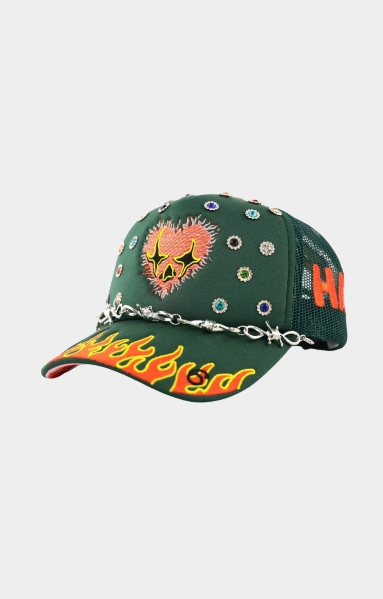 Angled view of LOVE HARD rhinestone trucker hat.