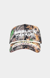Toxicity Trouble In Paradise trucker hat in Real Tree camo front view.
