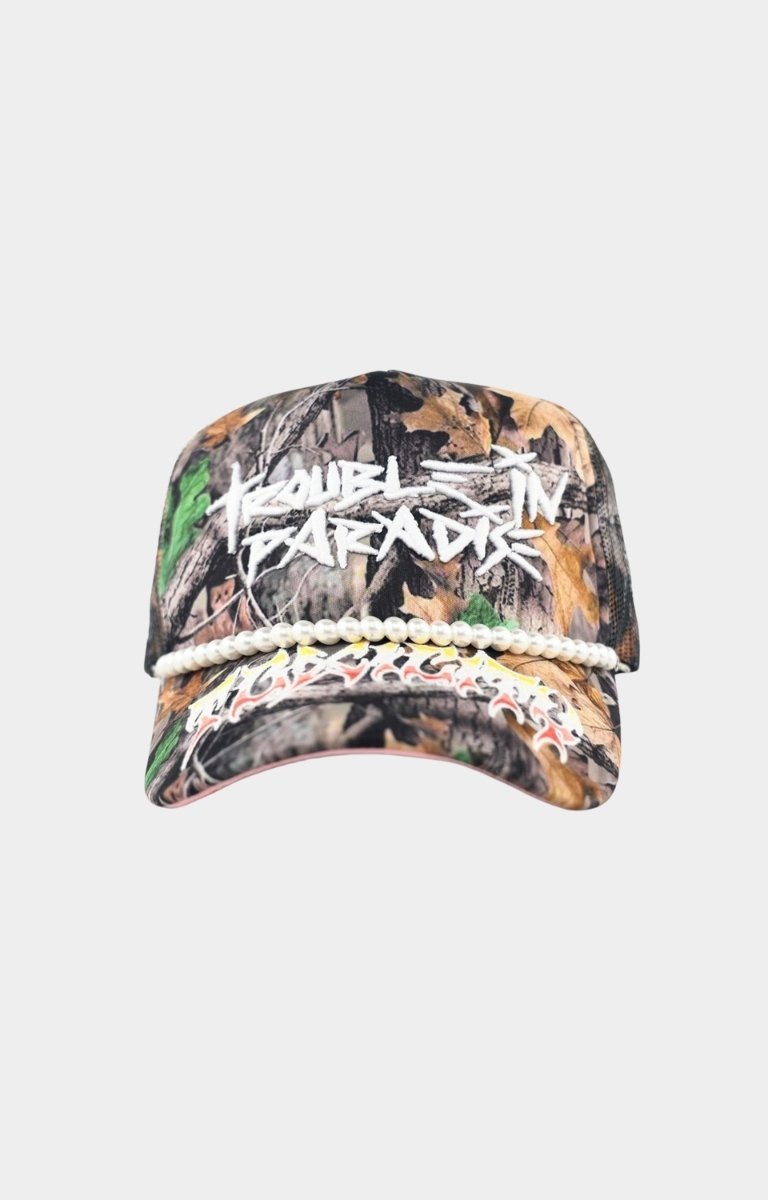 Toxicity Trouble In Paradise trucker hat in Real Tree camo front view.