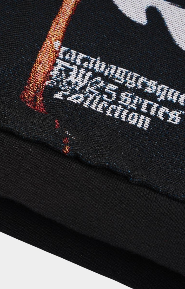 Closeup of embroidery and fabric texture on VeryRare Antihero Judith Hoodie.