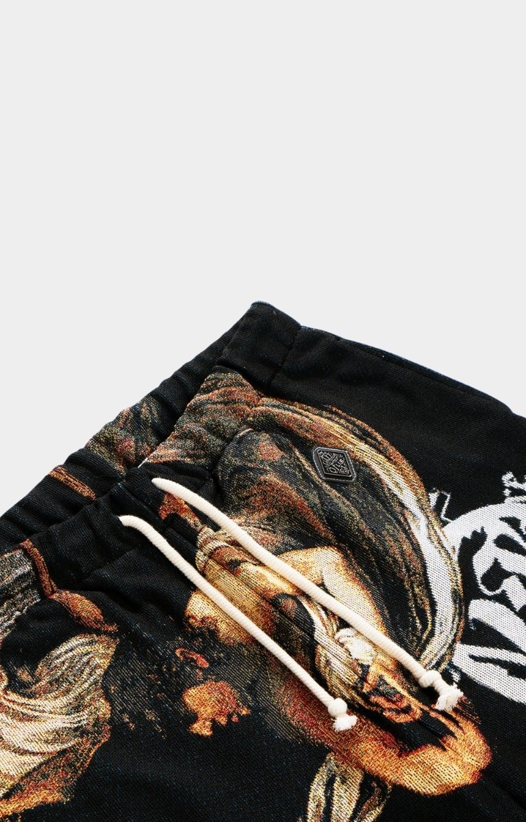 Detail closeup of Caravaggio artwork and appliqué patch on VeryRare Calling of Saint Matthew Pants.