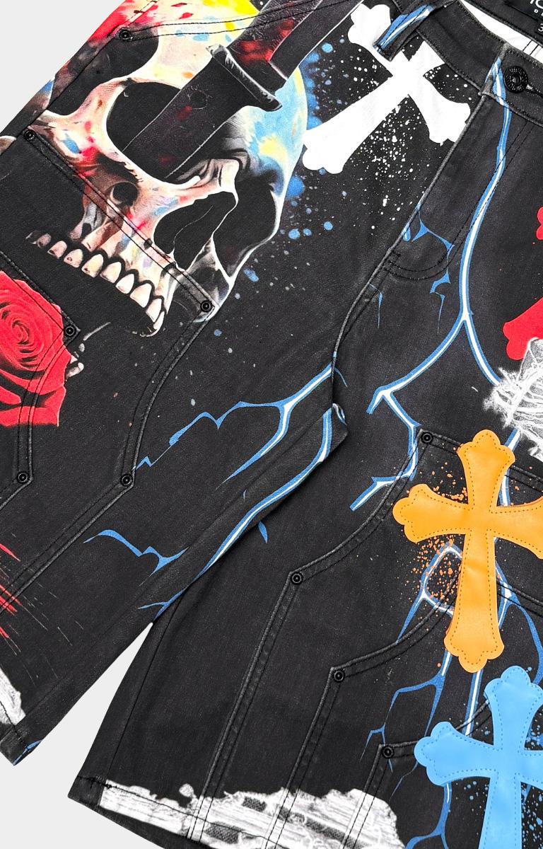 Close-up of graphic patch details on Vicious black denim shorts.