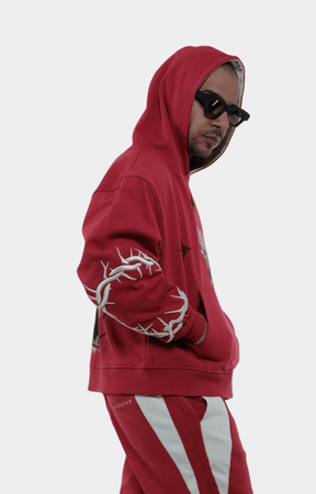 Side view of Vie Riche Dark Angel Hoodie in Red with graphic print.