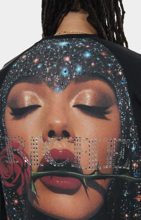 Close-up of crystal and print detailing on Vie+Riche sweatshirt.